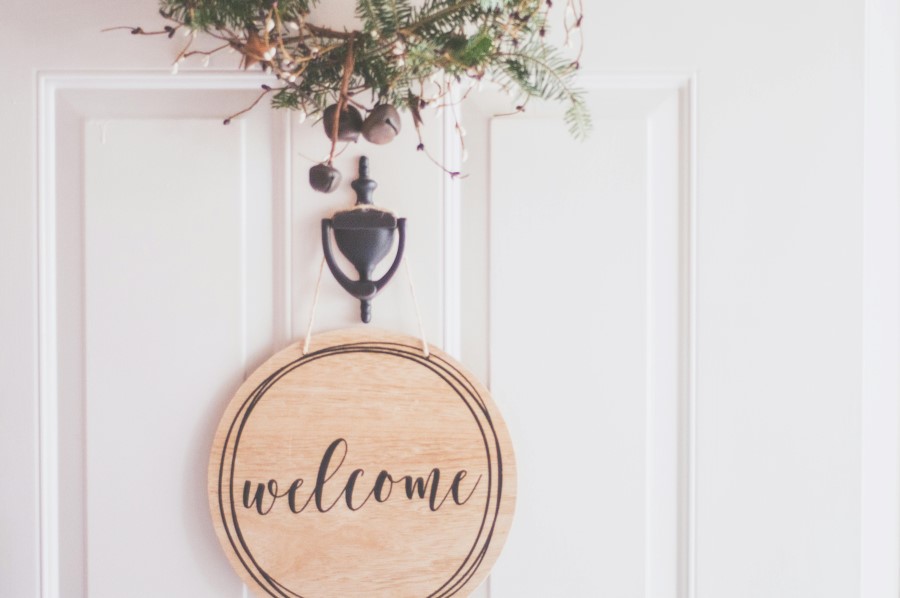 Photo of a welcome sign on a front door