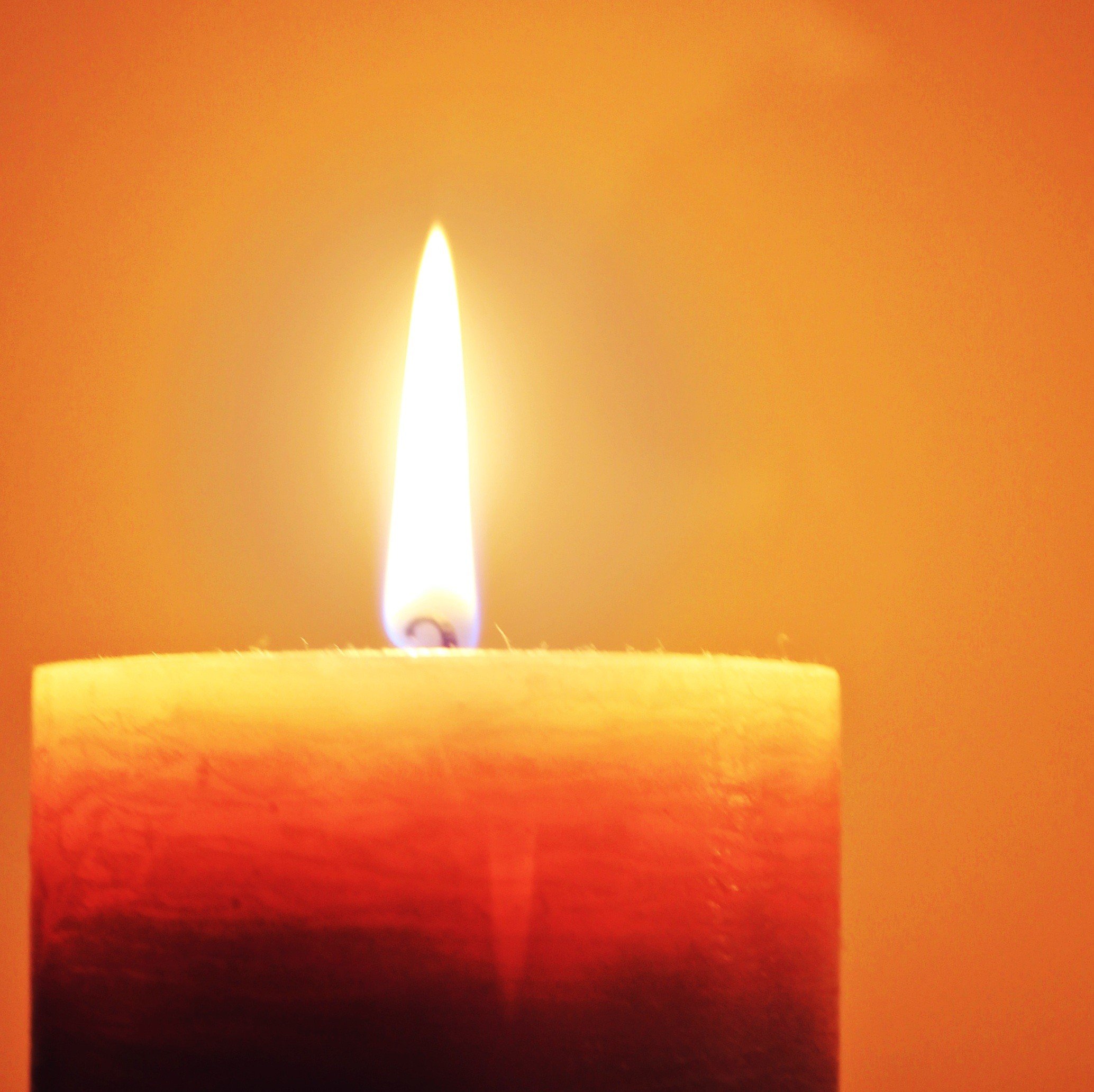 Photo of a burning pillar candle