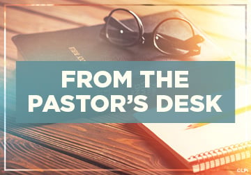 Photo showing an open book, glasses and the text "From the Pastor's Desk"